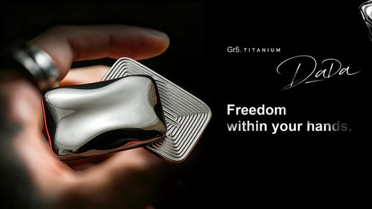 A hand holding polished and grooved DADA titanium slider parts in the official Kickstarter video cover